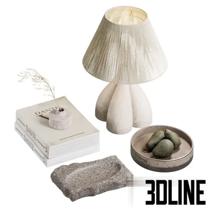 Detailed 3D model of a neutral-toned decorative set, including a tripod base lamp with a linen shade, two decorative books, a carved stone dish, and a small vase with dried grass.