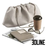 3D model of a fashion lifestyle set including a beige gathered leather clutch bag with chain, sunglasses, a coffee cup, a notebook, and a Kinfolk magazine.
