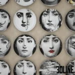 3D model collection of Piero Fornasetti "Tema e Variazioni" decorative wall plates, featuring various surreal black and white portraits of Lina Cavalieri with glasses, moustaches, and masks.