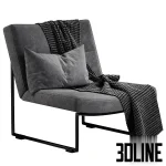 3D model of the Hebbes armchair by Harvink, featuring a continuous black metal tube frame, light grey upholstery, and styled with a houndstooth throw blanket and lumbar pillow.