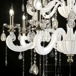 High-resolution 3D model of a large MEEROSEE crystal chandelier with a white frame, multiple candle bulbs, and numerous draped crystal strings and teardrop prisms.