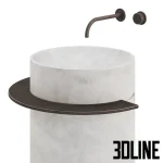 3D model of the Viola freestanding washbasin, featuring a cylindrical body made of white marble with grey veins, accented by a dark metal towel ring and wall-mounted faucet.