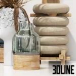 3D model of a boho decorative set featuring a white ceramic vase with a sculpted face filled with dried palm leaves, geometric wood shapes, and blue glass vases.
