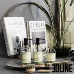 3D model set of modern kitchen accessories including Meraki soap dispensers, Cereal and Kinfolk magazines, a glass vase with twigs, and textured ceramic tea set.