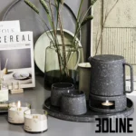 3D model set of modern kitchen accessories including Meraki soap dispensers, Cereal and Kinfolk magazines, a glass vase with twigs, and textured ceramic tea set.