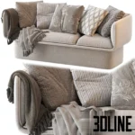 3D model of the Block Sofa by Missana featuring a playful, chunky design with rounded edges, heavily styled with numerous patterned pillows and throw blankets.